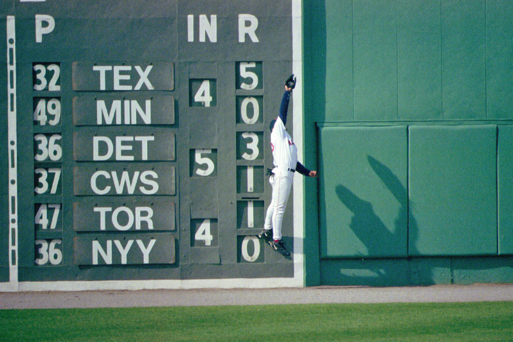 Troy O'Leary of the Red Sox makes a leaping catch in front of the Green Monster, 1999.  Click for next photo.