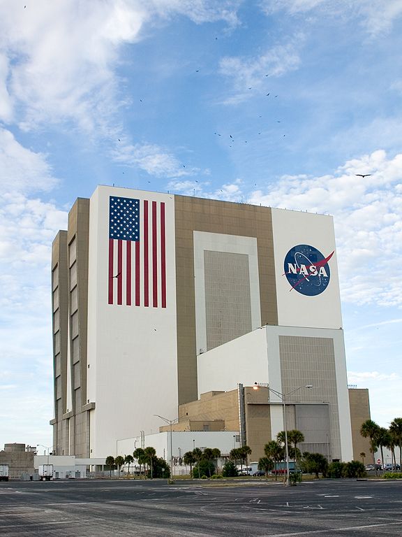 NASA's huge Vehicle Assembly Building. Dec. 27, 2002.  By the way, all the little black dots above the building are vultures.  Click for next photo.