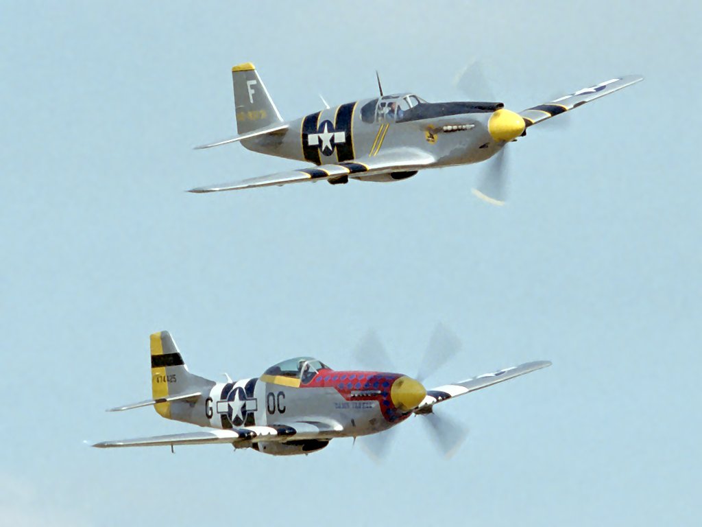 The featured plane at this show, the North American A-36A Invader (top), shown with its much more famous sibling, the P-51D Mustang.  Click for next photo.