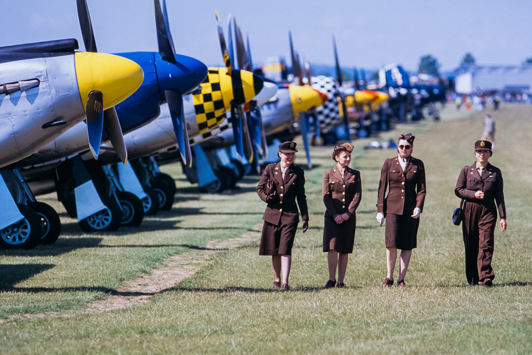 Latter-day WACs walk the flight line.  Click for next photo.