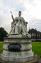 Queen Victoria, Kensington.  The plaque reads, "Victoria. R. -1837- Here in front of the palace where she was born and where she resided vntil her accession.  Her loyal Kensington svbjects erect this statve.  The work of her davghter to commemorate fifty years of her reign."