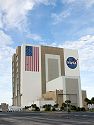 NASA's huge Vehicle Assembly Building.  By the way, all the little black dots above the building are vultures.