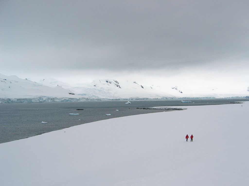 A couple of hikers head toward the Argentine station on Half Moon Island.  Click for next photo.