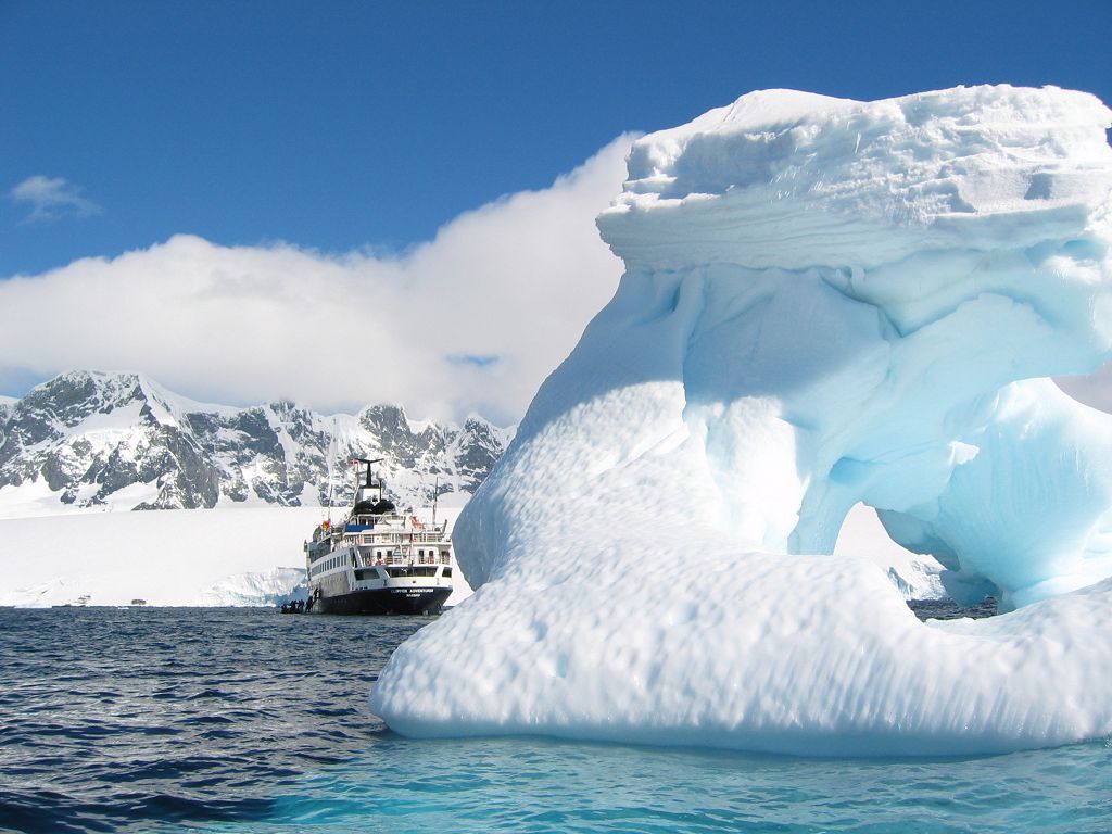 Iceberg and ship near Palmer Station, Dec. 4.  Click for next photo.