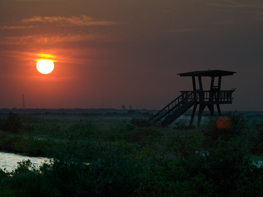Sun sets over the observation tower at Merritt Island National Wildlife Refuge.  Click for next photo.