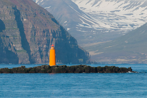 Lighthouse at the entrance to Eyjafjörður fjord, Iceland.