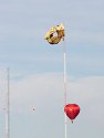 Near tragedy at the Albuquerque Balloon Fiesta.  The Smokey Bear balloon snagged on a radio tower and the three occupants of the basket had to climb down 600 feet to safety.  Click here for a more detailed photo.