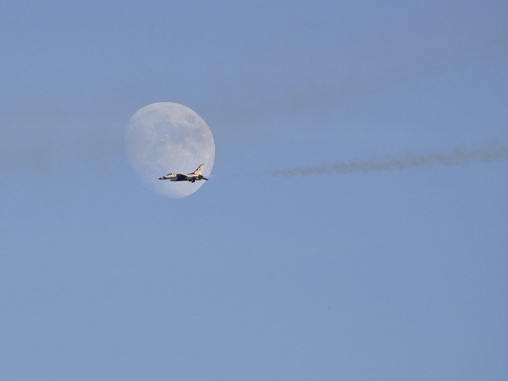 Thunderbird passes in front of the Moon, Aviation Nation in Las Vegas.  Click for next photo.