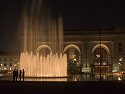 A group watches the fountain in front of Union Station, Kansas City, while waiting for a photographer (not me) to set up a shot.