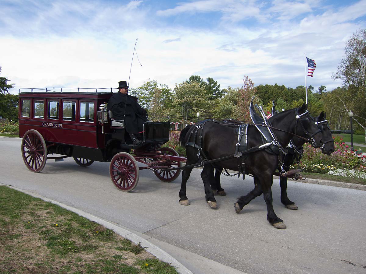 There are no motor vehicles on Mackinac Island, Michigan.  If you are staying at the Grand Hotel, this carriage picks you up at the dock.  Click for next photo.