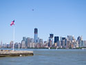 Flag on Ellis Island looking toward lower Manhattan, New York.