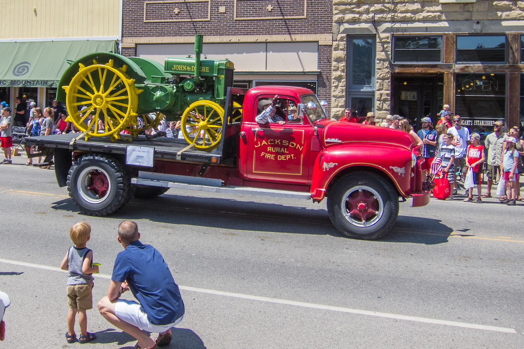 4th of July rodeo parade, Red Lodge, MT, 2021.  1925 John Deere tractor on the back of the truck.  Click for next photo.