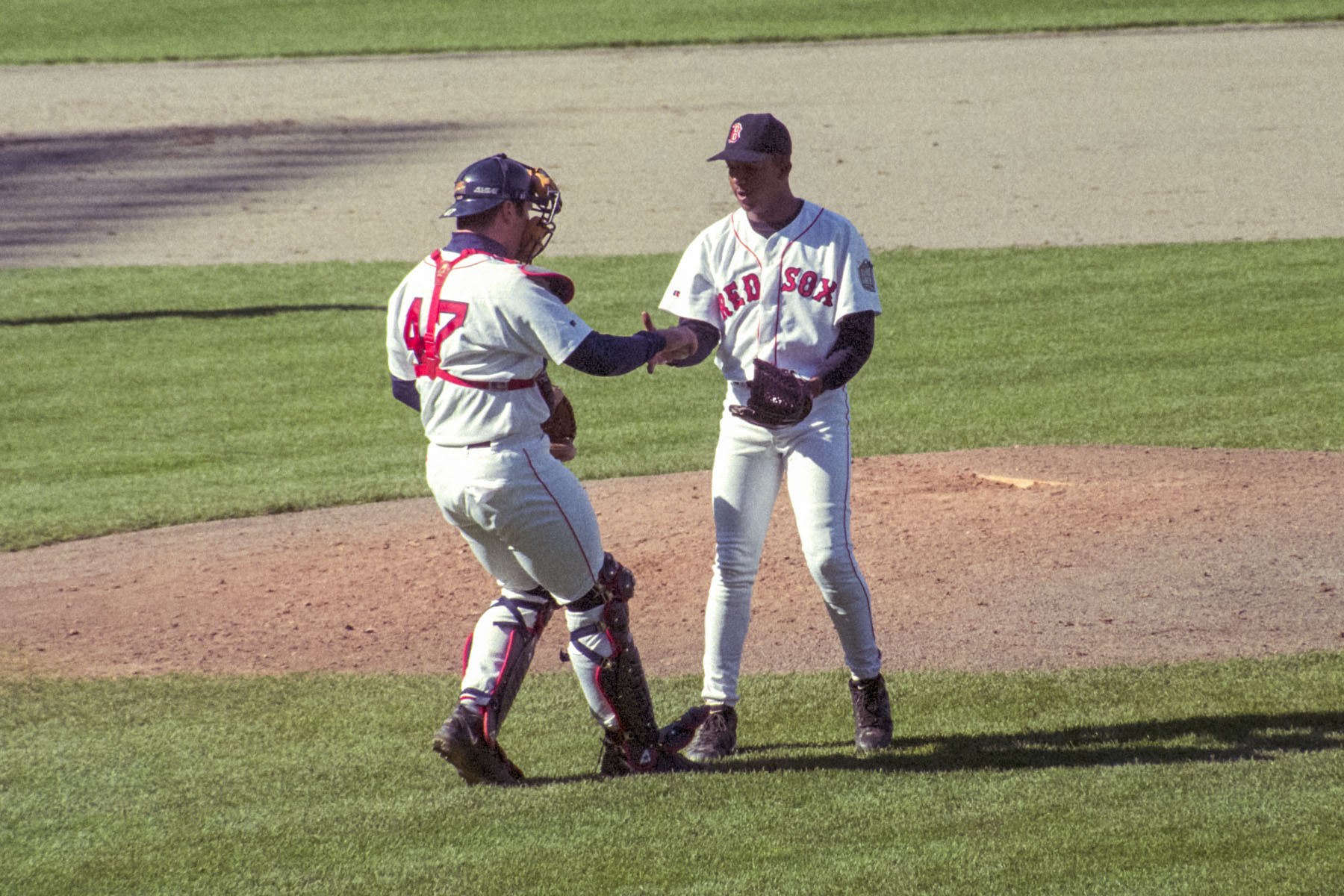 Jason Varitek congratulates Pedro on the complete game win.  Click for next photo.