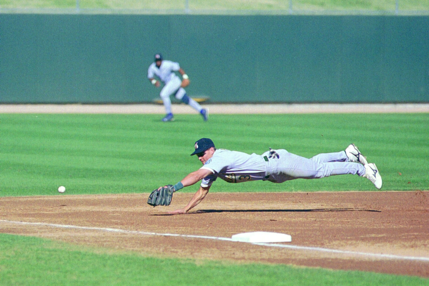 Adam Piatt, now with the A's, makes a dive in the 1999 Arizona Fall League.   Click for next photo.