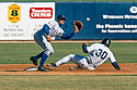 Phoenix� Larry Barnes (Angels) slides in as Grand Canyon shortstop Mike Young (Rangers) defends, Arizona Fall League, 2000.