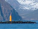 Lighthouse at the entrance to Eyjafjörður fjord, Iceland.