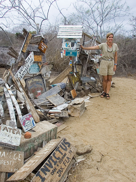 Lola at the Post Office barrel, Floreana Island, Galapagos.  Click for next photo.
