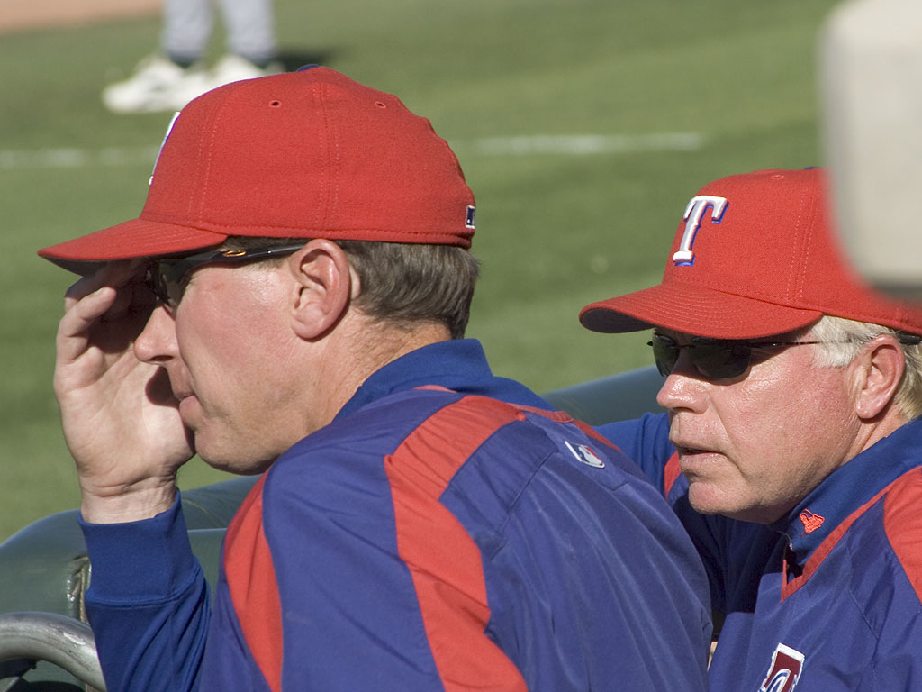 Rangers pitching coach Orel Hershiser and manager Buck Showalter keep an eye on the mound staff.  Click for next photo.