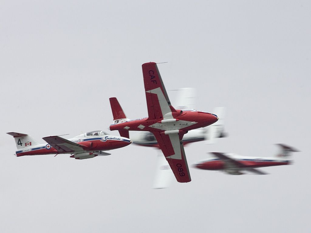 Four Snowbirds cross in a precise maneuver, Rhode Island ANG.  Click for next photo.