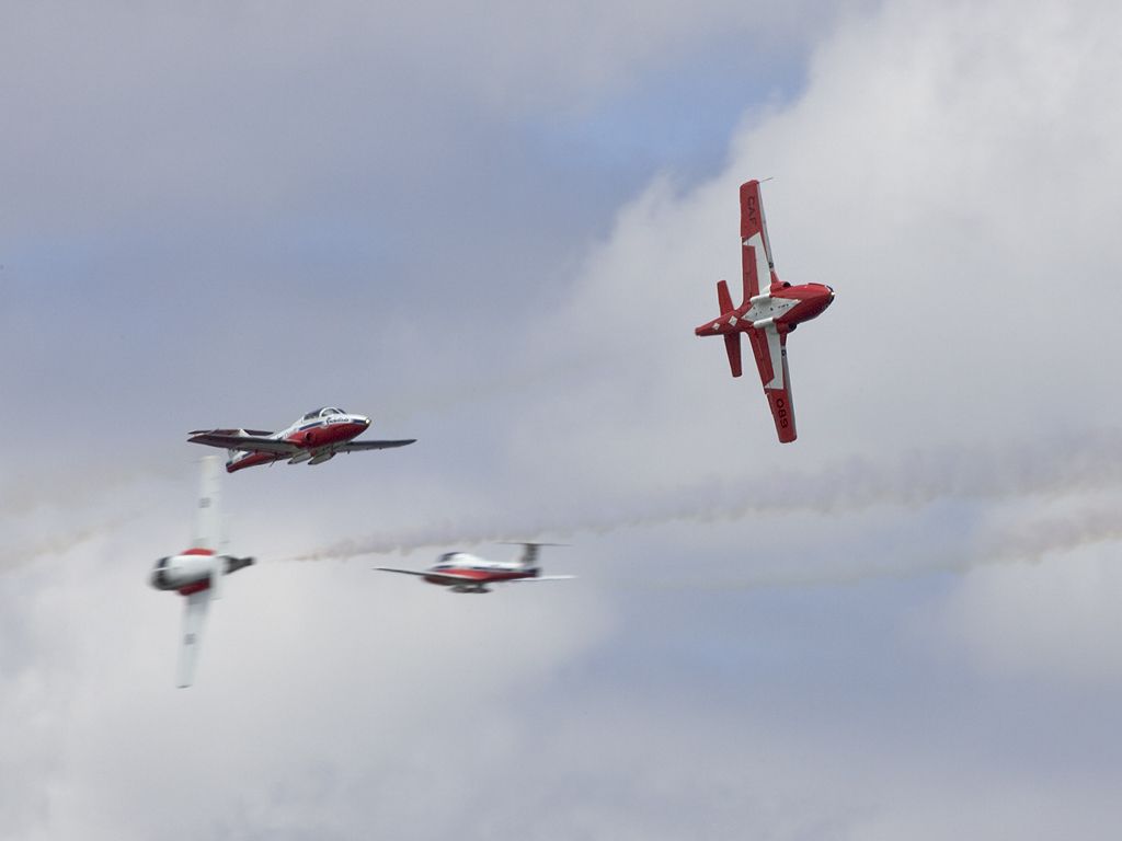 Four Snowbirds cross in a precise maneuver, Rhode Island ANG.  Click for next photo.
