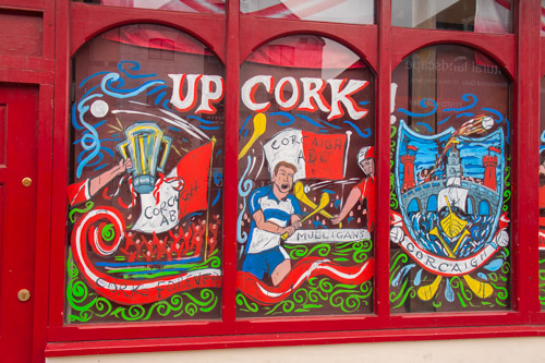 Cork pub painted its windows in support of the local hurling club playing in the All-Ireland championship that weekend, Ireland.