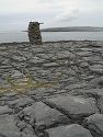 Stone cairn on Inis Meáin, Ireland.  The stone at the top points to Dun Aonghasa on Inis Mór.