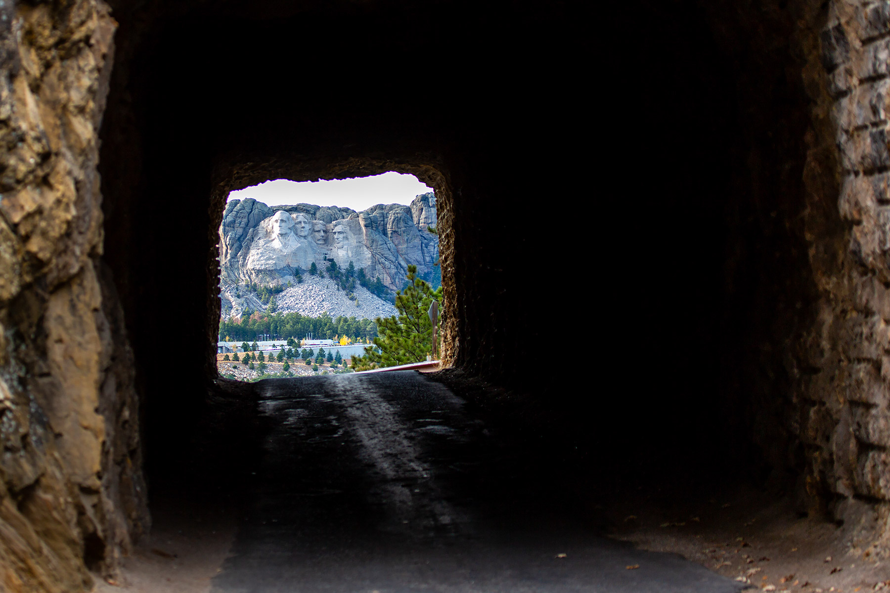 Mt. Rushmore framed by a tunnel on the Iron Mountain Road.    Click for next photo.