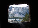 Mt. Rushmore framed by a tunnel on the Iron Mountain Road.  