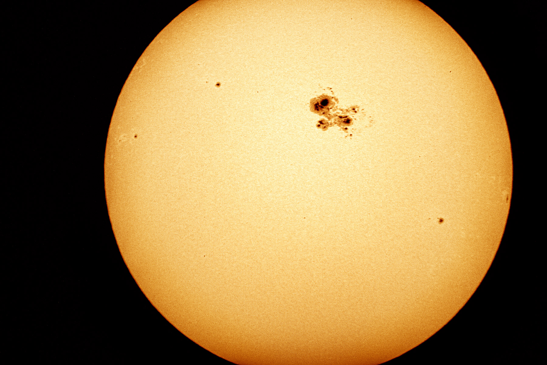 Big sunspot just before the start of a partial solar eclipse, October 23, 2014.  Click for next photo.