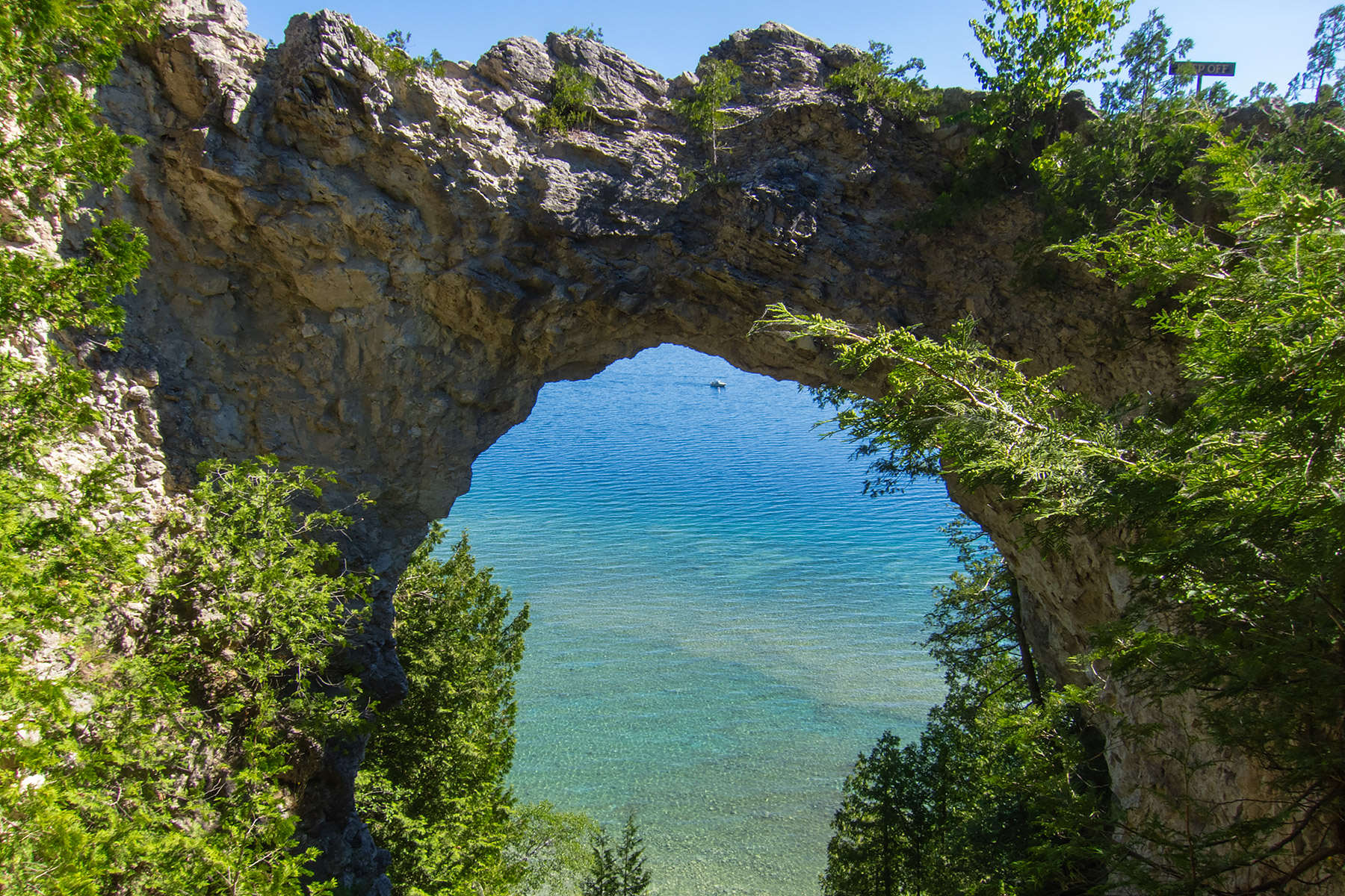 Looking through Arch Rock to a boat on Lake Huron, Mackinac Island, Michigan.  Click for next photo.