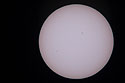 A bad image of the Transit of Mercury, May 9, 2016.  Mercury is the dot toward the lower left.  The day was mostly cloudy/hazy and I was surprised to get anything at all.  For some of my better sun images, see the Partial Eclipse from 2014, the Transit of Venus from 2004, or the Annual Eclipse as seen from Iceland in 2003.