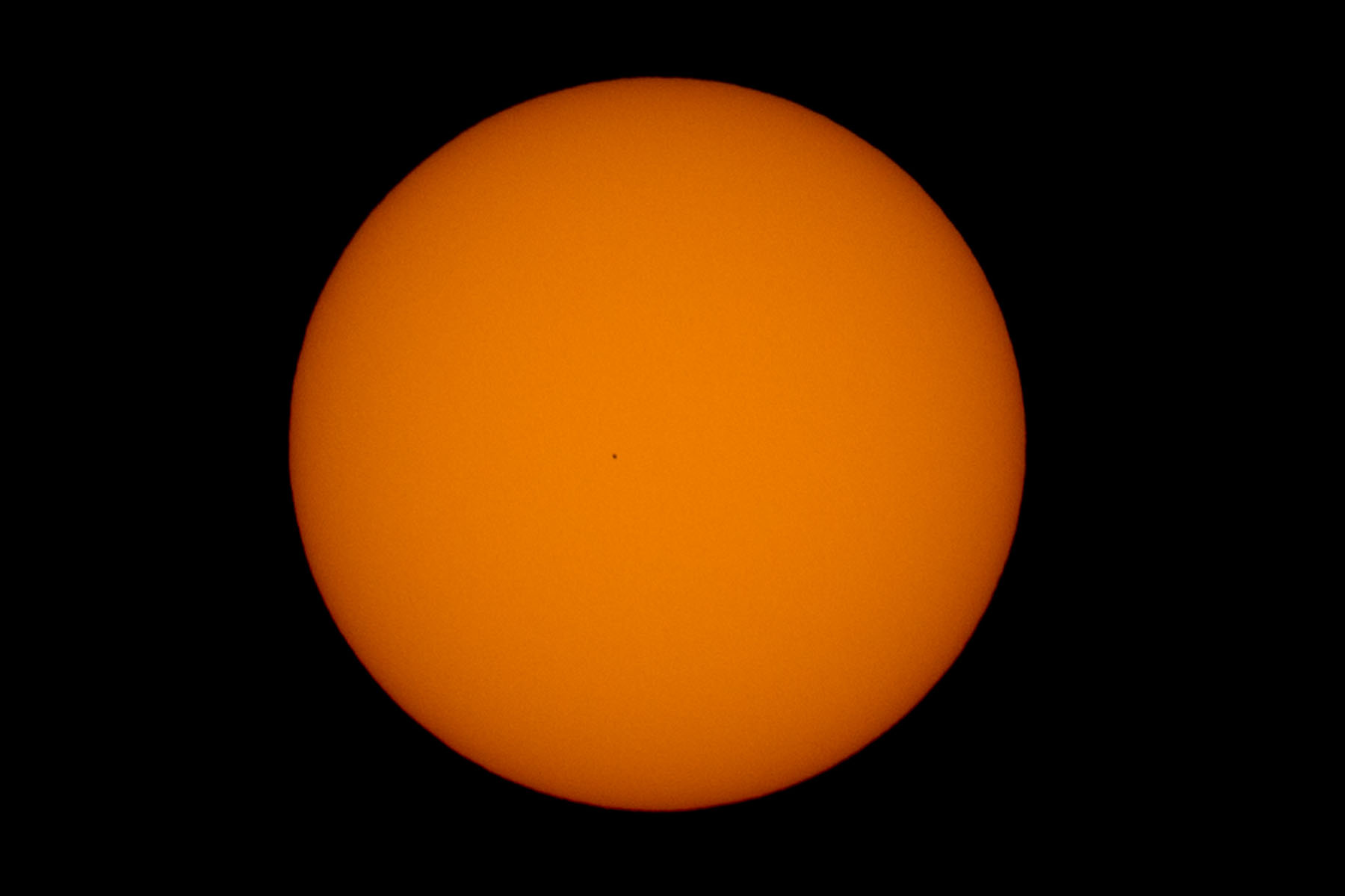 Transit of Mercury, Nov. 11, 2019.  Mercury is the tiny dot near the center of the Sun.  No sunspots, unusual.  Click for next photo.