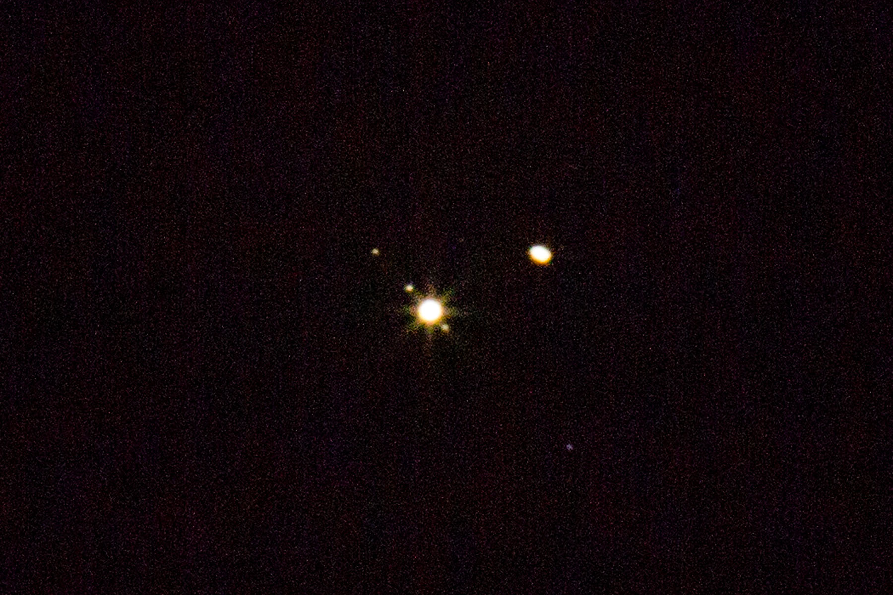 Conjunction of Jupiter and Saturn.  Also visible are the Jovian moons Europa to the right and Io and Callisto to the left.  Click for next photo.