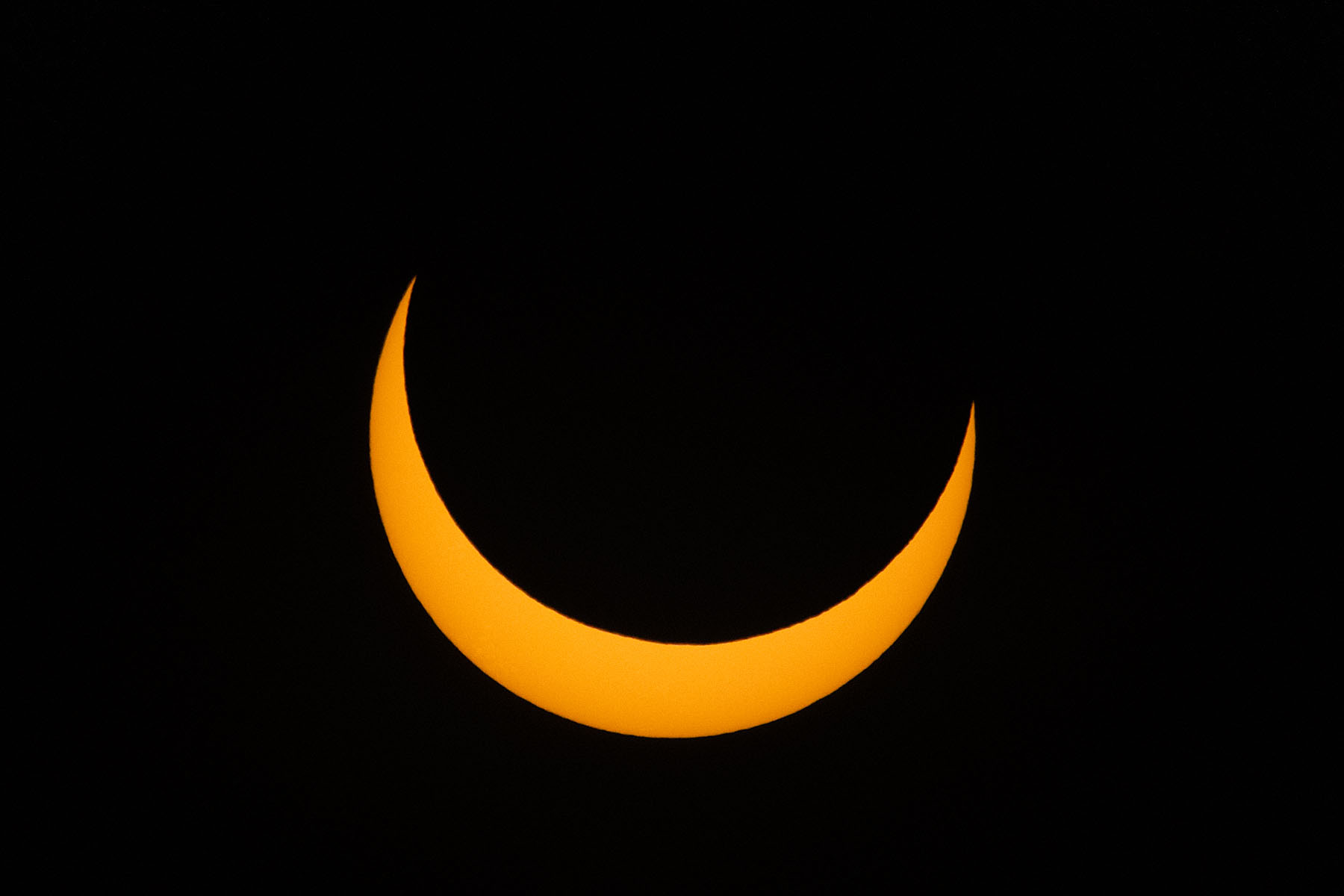 Annular solar eclipse, 11 minutes before peak, film solar filter on 100-400mm camera lens, 1.4x extender, Canon R10 camera.  Click for next photo.