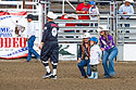 Mutton Busting contestant gets a picture with the rodeo queens, Home of Champions Rodeo, Red Lodge, MT.