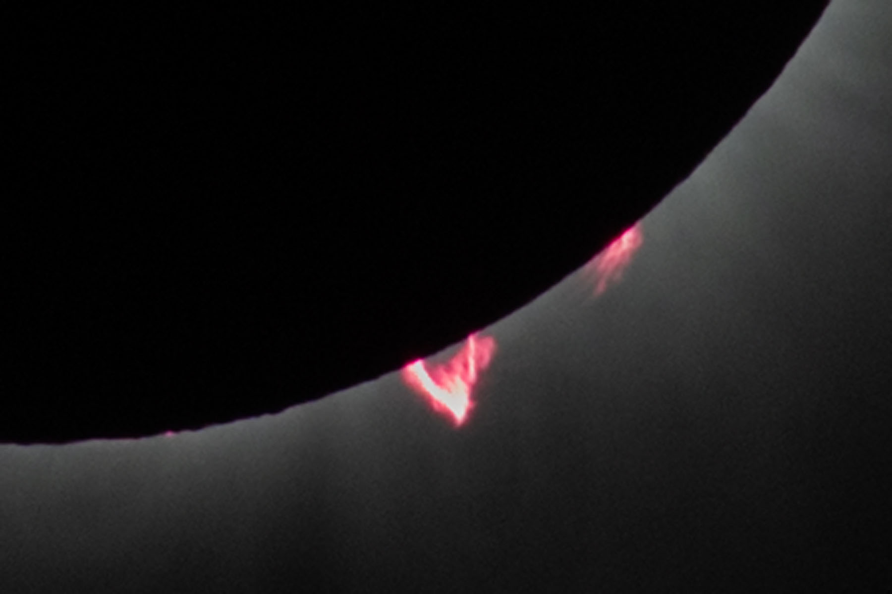 Detail of previous image.  Getting toward the end of totality, lower right prominence becoming more prominent.  Click for next photo.