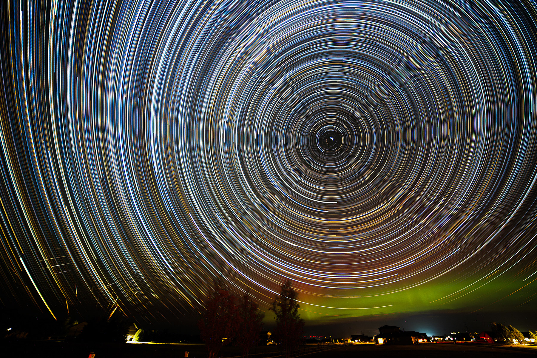 Star trails outshine the Northern Lights, Red Lodge, MT.  660 stacked images, five hours and 40 minutes.  Click for next photo.